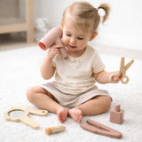 Toddler silicone hair stylist play set with hair dryer, mirror, comb, scissors, brush and styling tools for imaginative pretend salon play.