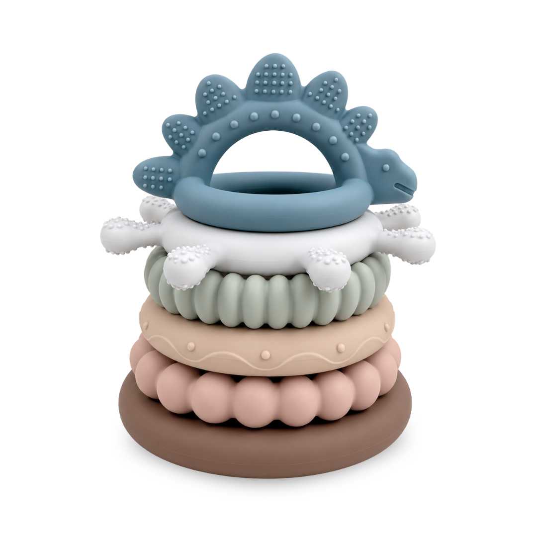 Stack of colorful silicone teething rings on a white background